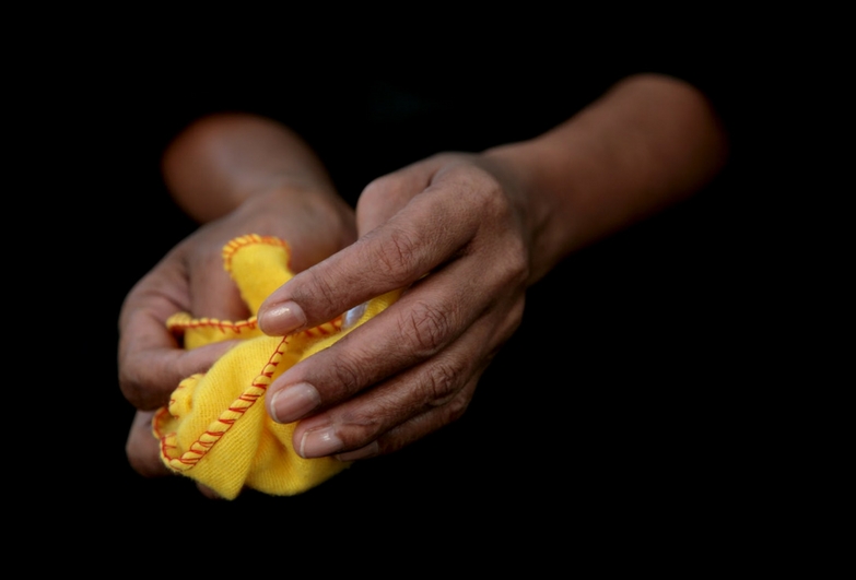 A domestic worker cleans