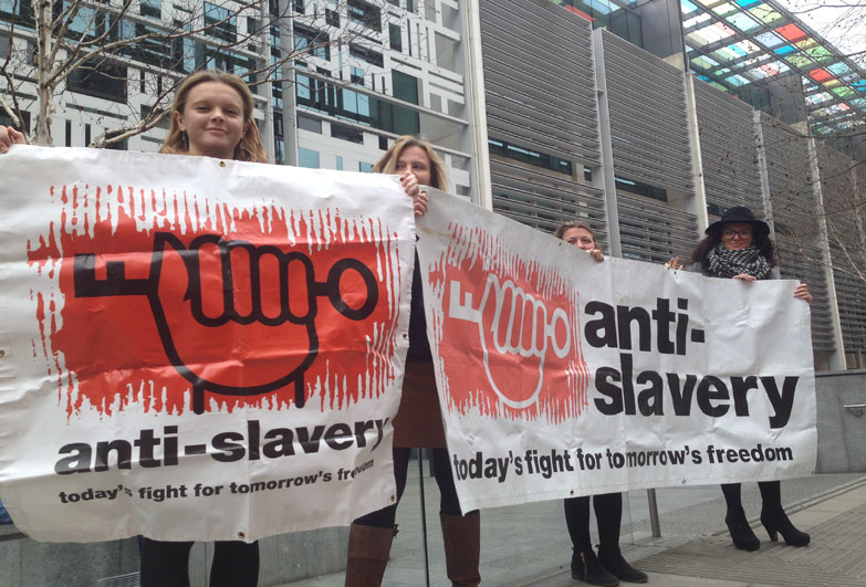 Anti-Slavery staff demonstration and holding banner