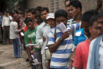 Prospective migrants queue up for a passport in Kathmandu, Nepal.