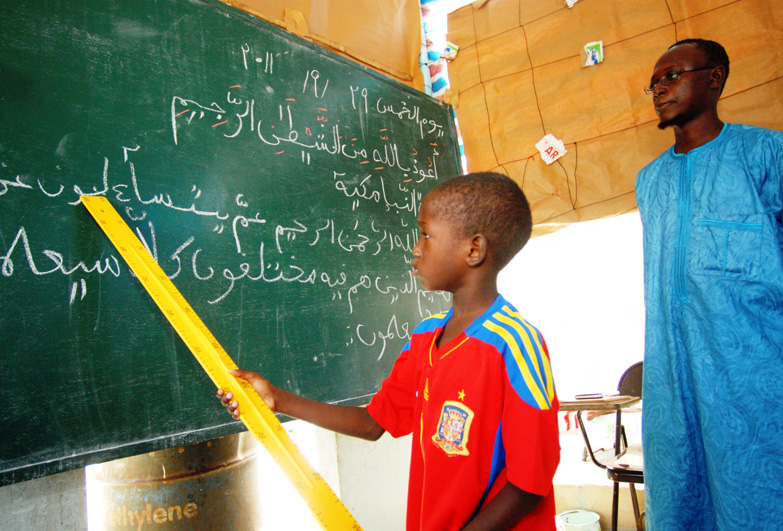 Senegal child at blackboard