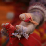 Hand of person in slavery wrapped in cloth for protection