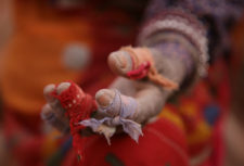 Hand of person in slavery wrapped in cloth for protection