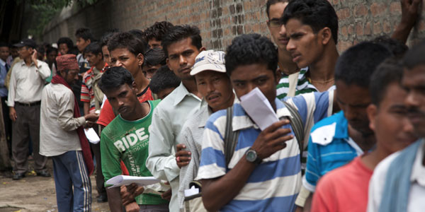 Nepali workers queueing for permits to migrate to the Middle East