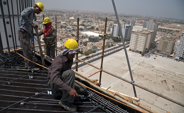 nepali migrant workers on construction site