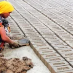 image of a woman working in a brick kiln