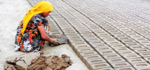 image of a woman working in a brick kiln