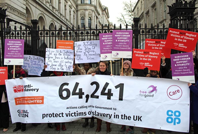 Petition hand in group outside Downing Street London