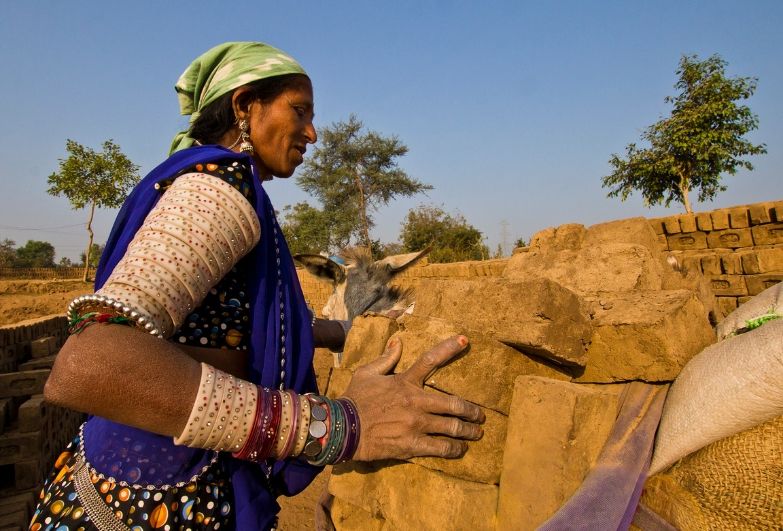 female brick maker in India