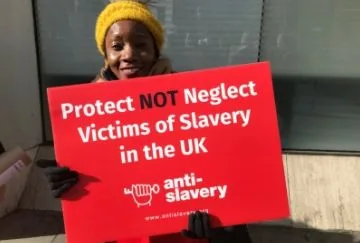 woman holding a protest sign