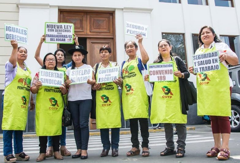 women holding protest signs