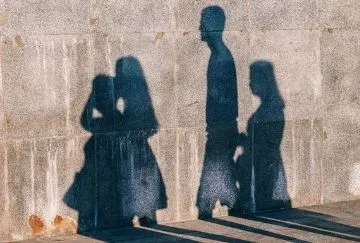 Silhouettes of people on a wall