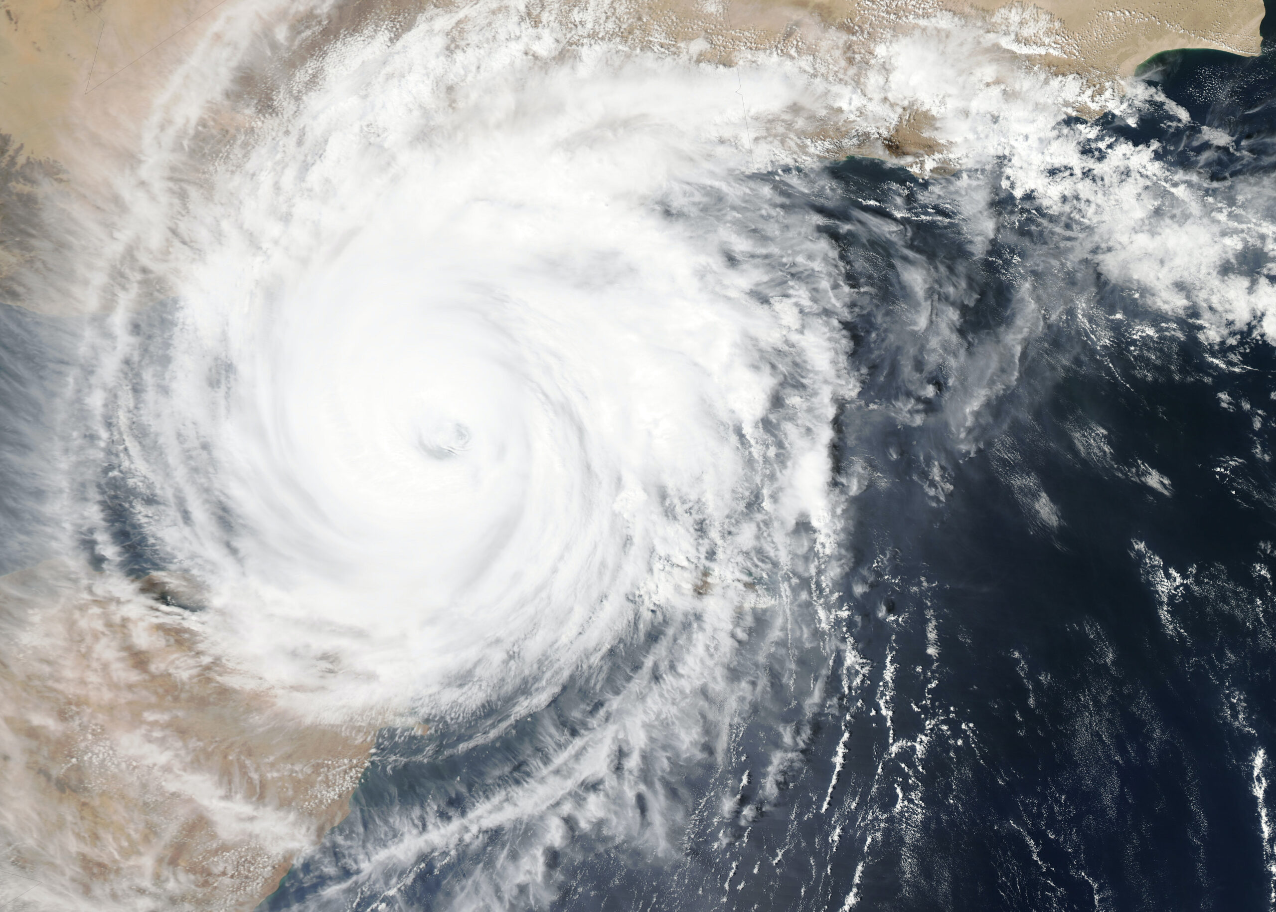 climate change and modern slavery - hurricane satellite image