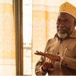 An image of a man speaking at an event