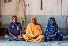 People sitting by Daouda Corera for Anti-Slavery International