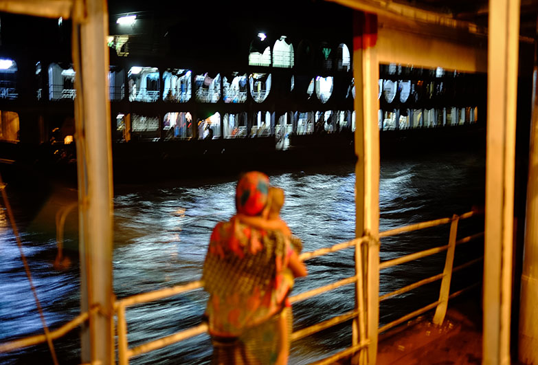 Mother and child on a boat at night