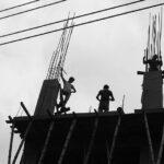 People silhouetted on a construction site. Credit Jonathon Moore Photography