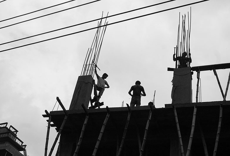People silhouetted on a construction site. Credit Jonathon Moore Photography