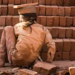 A child works in a brick kiln. Credit Bharat Patel.