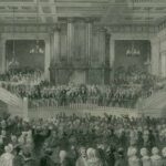 Black and white photo showing hundreds of people packed into a hall for the 1841 conference of slavery abolitionists