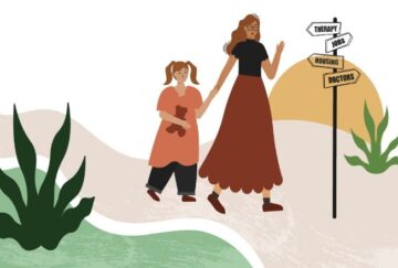 A woman leads a child past a signpost