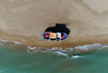 A small boat on the sea shore