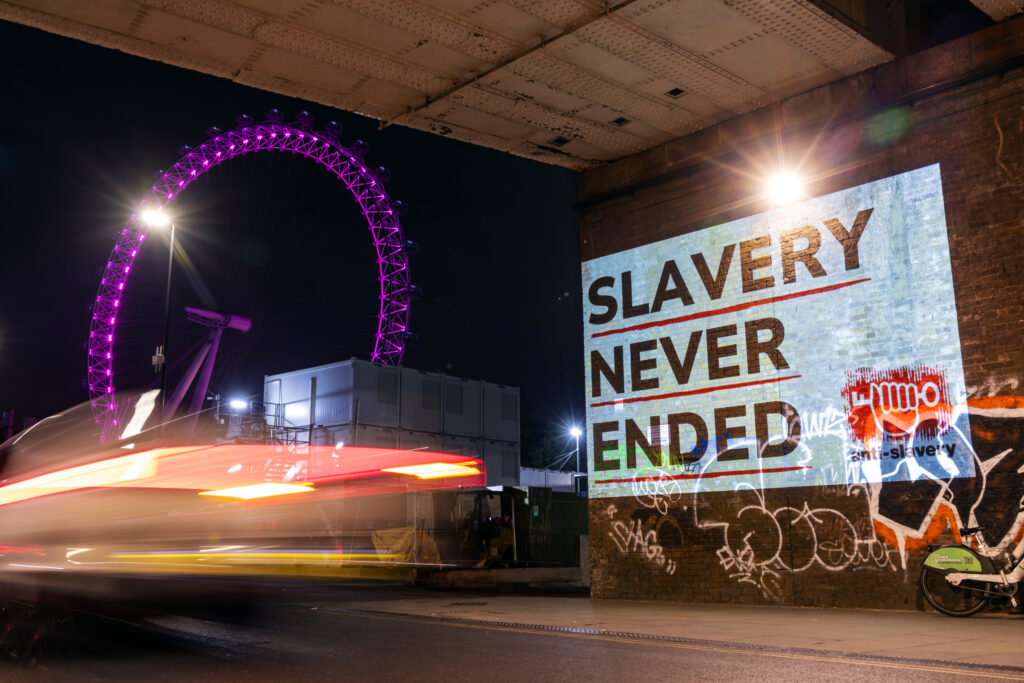 Slavery never ended projection on Westminster Bridge