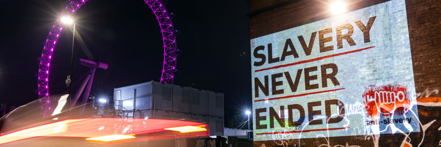 Slavery never ended projection on Westminster Bridge